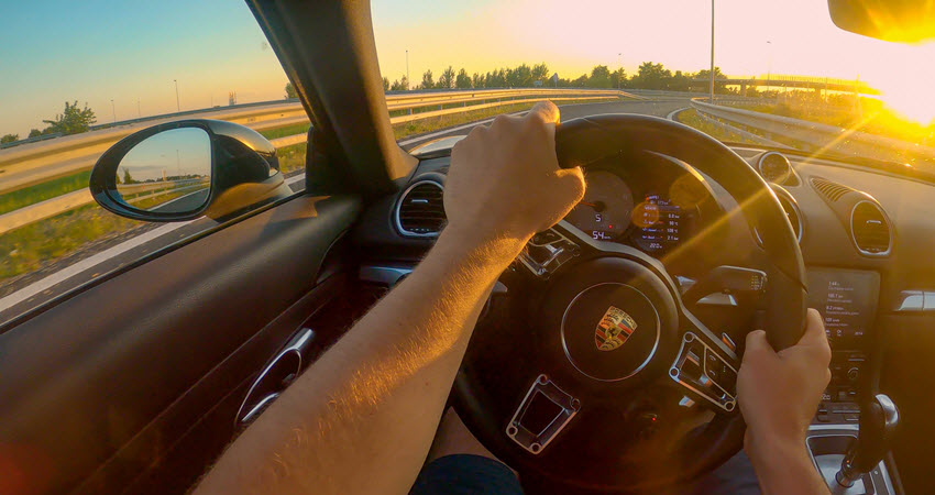 Man Driving Porsche Car